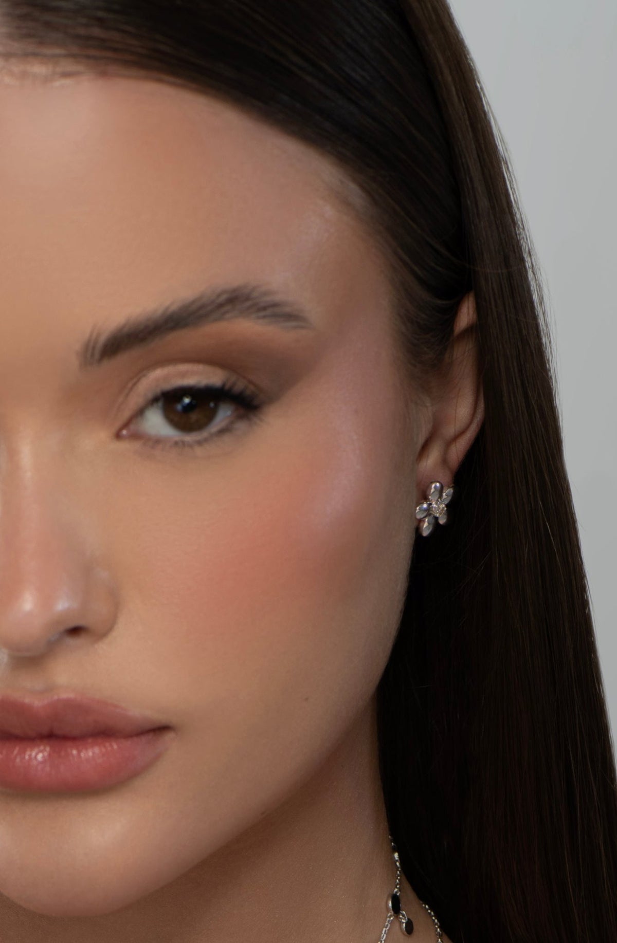 Gold Blossom Earrings styled on a model