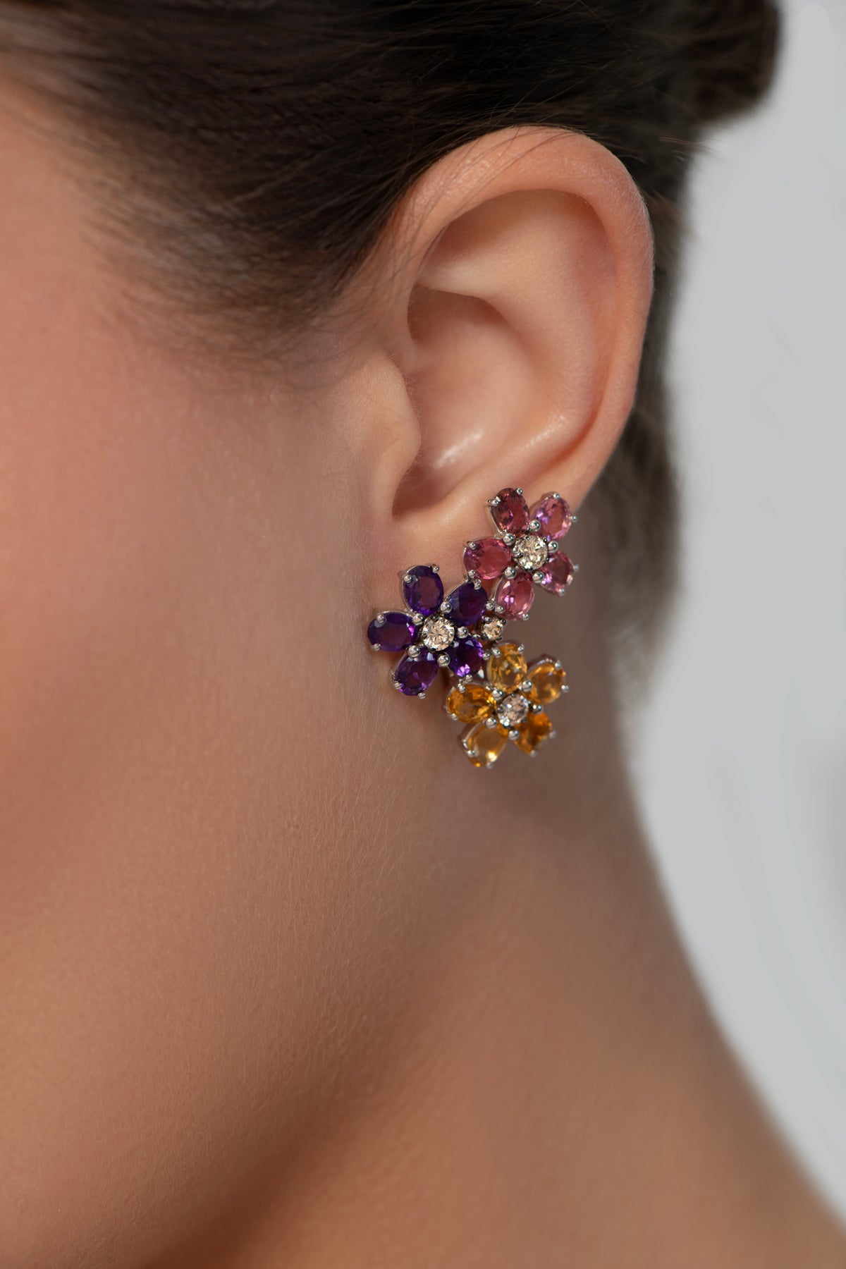 Model wearing the Triple Blossom Earrings